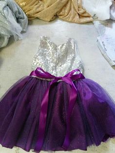 purple flower girls dress, Silver sequined and purple tutu dress, glittered tutu dress Purple Fitted Pageant Dress For Party, Fitted Purple Pageant Dress For Party, Purple Tulle Dresses With Sequins, Purple Tulle Princess Dress For Party, Purple Princess Dress With Sequins, Purple Sequined Princess Dress, Princess Style Purple Sequin Dress, Purple Glitter Tulle Party Dress, Purple Tulle Pageant Dress For Party