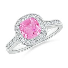 Drawing inspiration from elegant vintage patterns, the cathedral set pink sapphire ring is crafted in platinum. The blossomy pink sapphire is surrounded by a halo of glimmering diamonds. Additional pave set diamonds on the shank and bezel set diamonds on the gallery lend a glamorous element to this cushion pink sapphire ring. Pink Sapphire Jewelry, Pink Sapphire Pendant, Pink Sapphire Earrings, Pink Engagement Ring, Pink Sapphire Ring Engagement, Engagement Rings Cushion, Pink Sapphire Ring, Ring With Diamond, The Cathedral