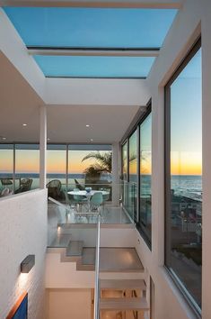 an open floor plan with stairs leading up to the beach