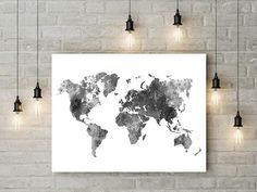 a white brick wall with lights hanging from it and a large map on the wall