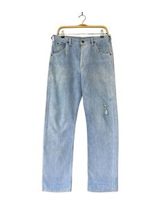 J9 Vintage 90s Lee Light Blue Jeans Lee Zipper Fly Denim Distressed Non Selvedge Faded Wash Jeans Lee Straightcut Classic Fit Lee Riders  Size on Tag :  Details Measurement  Waist : 31'inches Inseam : 32.5'inches Leg Opening : 17'inches Front Rise : 12'inches Thigh : 26'inches Knee : 18'inches Outseam (Length) : 44'inches Hips : 42'inches Condition :  Great Condition.Minor stains defect,discoloration and holes please refer pictures detail.‼️ 📮 SHIPING > WE ARE USING DHL EXPRESS SHIPING ITS TAKE 3-5 ARRIVE.PLEASE DROP YOUR PHONE NUMBER AFTER PURCHASE.📮 Vintage Jeans With Frayed Hem For Spring, Spring Vintage Jeans With Frayed Hem, Vintage Denim Blue Jeans With Frayed Hem, Vintage Denim Jeans With Frayed Hem, 90s Ripped Light Wash Jeans, 90s Style Ripped Light Wash Jeans, 90s Style Light Wash Cutoff Jeans, 90s Light Wash Cutoff Jeans, Retro Light Wash Jeans With Frayed Hem