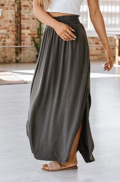 We are obsessed with our Eliza Maxi Skirt w/ Pockets, and you will be too! Our skirt features a smocked waist, side slit, functional pockets and maxi length. We love it because it is so lightweight and comfortable! The breathable fabric and variety of color options make it a must-have all season long! Model Info: 5'5"-5'7", size 2, wearing smalls Fabric: 57% Polyester38% Rayon 5% Spandex Small Eggplant, Boho Style Outfits, Curvy Dress, Style Outfits, Dress Romper, Modest Outfits, V Neck Tops, Summer Wardrobe, Boho Style