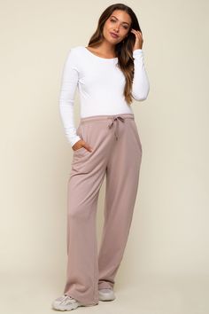 Details A pair of solid maternity joggers featuring wide legs, side pockets and an adjustable drawstring waist. Content + Care 100% CottonHand Wash Cold, No Bleach, Hang or Line DryImport Size + Fit Inseam: 29.5"Measured From: SmallProduct Code: 86519Model Stats: Height: 5'7"Bust: 32.5"Hips: 36"Wearing Size: Small Maternity Joggers, Athleisure Dress, Matching Sets Outfit, Baby Shower Dresses, Nursing Tops, Pink Blush Maternity, Midi Maxi Dress, Wide Legs, Plus Dresses