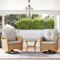 two chairs sitting next to each other on top of a wooden floor