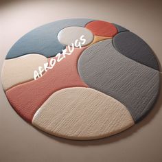 a round rug with different colors and shapes on the bottom that says afrozugs