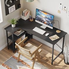 a computer desk with a monitor, keyboard and mouse next to a chair on the floor