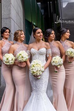 the bride and her bridesmaids are all wearing nude colored dresses