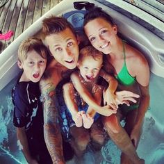 a group of people in a swimming pool with the caption family, the roman soldiers love you