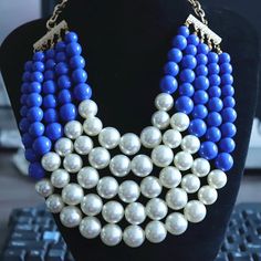 This Chunky Imitation Pearl Statement Necklace features a captivating combination of lustrous blue beads and delicate white imitation pearls, meticulously arranged to create a stunning contrast and visual appeal. The chunky design adds a touch of drama and boldness to any outfit, making it the perfect accessory to elevate your look for any occasion. Type: Chokers Necklaces Style: TRENDY Pearl Type: Simulated-pearl Shape\pattern: Geometric *Note Delivery Time: Due to the current global crisis (CO Blue Pearl Chain Necklace, Blue Pearl Necklace With Pearl Chain, Blue Pearl Necklace With Round Beads, Blue Pearl Jewelry For Party, Party Pearl Jewelry In Blue, Blue Pearl Beaded Necklace For Party, Blue Beaded Pearl Necklace, Blue Pearl Necklace For Party, Necklaces Style