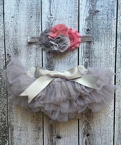 two pieces of gray and pink tutule with bows