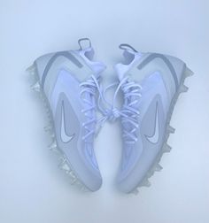 the white nike air max sneakers are on display in front of a white wall and floor