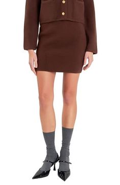 This knit miniskirt fashioned in a pencil silhouette is a season essential to elevate your day-to-night ensemble. 79% acrylic, 12% wool, 8% nylon, 1% spandex Hand wash, dry flat Imported Fitted Knit Bottoms Of Mini Length, Fitted Knit Mini-length Bottoms, Fitted Knit Mini Length Bottoms, Stretch Brown Mini Skirt For Fall, Trendy Fitted Pencil Skirt For Winter, Fitted Knit Skirt For Work, Modern Fitted Pencil Skirt For Fall, Fitted Solid Mini Skirt For Fall, Knit Mini Skirt For Fall