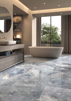 a bath room with a large tub and a mirror on the wall next to a window