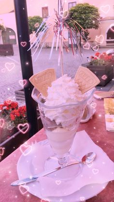 an ice cream sundae with wafers and whipped cream