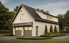 a two story garage with an attached porch