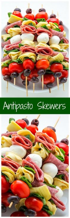 several different types of skewers with tomatoes, olives and meat on them