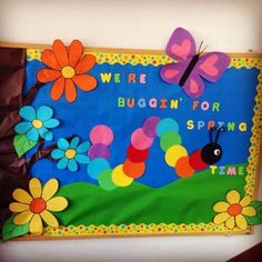 a bulletin board with flowers and a butterfly on it that says, we're buggin for spring