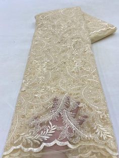 This high quality Fabric is measured in 5 Yards With Embroidered Beading and Sequin. It is soft, very delicate and beautiful. This high Quality Fabric is made with Fashion embroidered rhinestones can be used in making party wedding dresses, skirts, shawls, scarves and other other fashion apparels as you would like. Size : Length : 5 yards (180 inch). Width: 50 inch (Please allow slight deviation for the measurement data ,±1 inch) Material: 100% Polyester, Tulle Lace Fabric, Eco-Friendly embroide Elegant Beaded Lace Embroidered Fabric, Elegant Embroidered Organza Lace, Elegant Floral Embroidered Fabric For Banquet, Elegant Embroidered Fabric With Rhinestones For Wedding, Elegant Beaded Sequin Fabric For Wedding, Elegant Embroidered Lace For Party, Elegant Rhinestone Embroidered Fabric For Weddings, Elegant Organza Embroidered Fabric For Banquets, Elegant Beige Embellished Embroidered Fabric