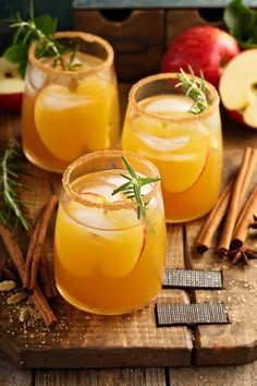 caramel apple sangria with cinnamon garnishes and apples in the background