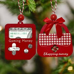 two christmas ornament hanging from a tree decorated with red and white money tags