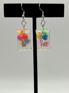 1 pair of hand crafted candy bag earrings  cute to go with any colorful outfit. disclaimer: quantity as well as color of heart flakes in the candy bag will vary and may not match the picture! Sweet Handmade Earrings For Gift, Sweet Handmade Earrings As Gift, Cute Colorful Earrings For Gifts, Cute Colorful Earrings As Gift, Cute Colorful Earrings For Gift, Sweet Drop Earrings As A Gift, Sweet Drop Earrings For Gift, Playful Earrings With Cute Design As Gift, Sweet Handmade Earrings For Party