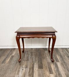 Elegant Early American Style side Tea table with pull out shelves and Queen Anne style legs making it the perfect multi-purpose reading table for a tea lounge or small guest room. Condition  is fair. The table is attractive and sturdy. The top has some water rings and would need refinishing or painting. SHIPPING is not free for this item. Please message with a zip code and I can get you a shipping quote.  Measurements:  Height 24.5 inches   Depth 18 inches   Width 18 inches Small Guest Room, Style Side Table, Early American Style, Tea Lounge, Reading Table, Queen Style, Scalloped Skirt, Pull Out Shelves, Water Rings