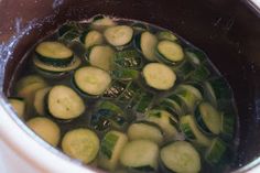 cucumbers are being cooked in the pot on the stove