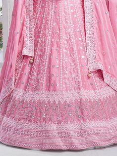 Elevate your style with the timeless elegance of this enchanting pink chiffon lehenga, adorned with intricate multi-embroidered work and shimmering sequins. The soft and flowing chiffon fabric drapes gracefully, exuding a delicate charm that is perfect for a variety of occasions, from weddings to receptions and beyond. Semi-stitched for convenience and comfort, the lehenga accommodates up to 42 inches, ensuring a flattering fit for different body types.
Paired with the lehenga is a chiffon choli Designer Pink Lehenga With Sheer Dupatta, Pink Anarkali Gown With Intricate Embroidery, Pink Organza Lehenga For Navratri, Pink Semi-stitched Embroidered Gown, Pink Organza Saree Lehenga, Pink Organza Lehenga With Zari Work, Pink Semi-stitched Anarkali Set With Intricate Embroidery, Pink Organza Choli For Navratri, Semi-stitched Pink Organza Lehenga