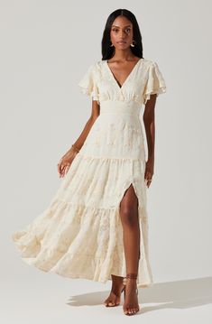 Embroidered flutter sleeve tiered maxi dress V-neckline, tie detail at back of neck Fully lined, concealed zipper at side seam Left leg slit above knee, elasticized back Self: 60% Polyester, 30% Acrylic, 10% Rayon Lining: 100% Rayon Dry clean only Style #ACDR102318 Country Chic Dress, Long Senior Picture Dress, Fall Engagement Dress, Ivory Boho Dress, Flowy Long Sleeve Dress, Country Chic Dresses, Senior Pictures Dresses, Texture Dress, Engagement Photo Dress