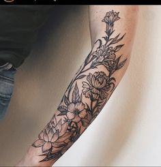 a person with a flower tattoo on their arm