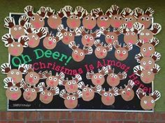 a christmas bulletin board with reindeers on it