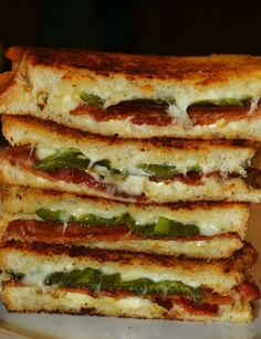 four grilled sandwiches stacked on top of each other