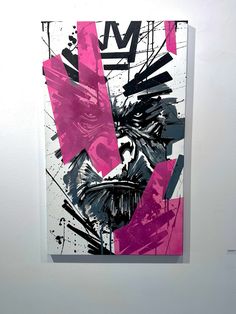 an abstract painting with pink and black shapes on a white wall next to a toilet