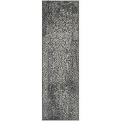 the runner rug is shown in grey and white tones, with an intricate design on top