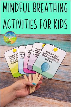 hand holding four cards with the words mindful breathing activities for kids