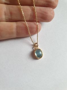 This minimalist Blue Topaz solid gold necklace was designed with a light blue December birthstone pendant, to beautifully accompany you through your busy days.The classic simple design is always pretty for day and evening, work or fun.The gold Blue Topaz necklace is handmade and delicate and available both with a 9kt or 14 karat pendant. The gold chain is made of 14k and available in a couple lengths.The clear Blue topaz necklace is a great birthstone necklace and a perfect chic and elegant gift Blue Topaz Oval Pendant Necklace As Gift, Blue Topaz Oval Pendant Necklace For Gift, Blue Topaz Birthstone Necklace With Oval Pendant, Blue Topaz Oval Pendant Necklace With Birthstone, Blue Topaz Round Pendant Necklace Gift, Gold Necklace With Blue Topaz Birthstone, Gift Blue Topaz Round Pendant Necklace, Minimalist Gold Jewelry With Blue Topaz, Blue Round Pendant Necklace For May Birthstone