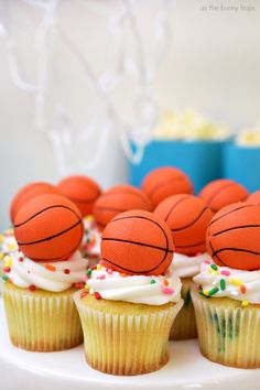 cupcakes decorated with basketball balls and sprinkles