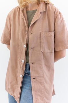 "This vintage workwear shirt has four white buttons, short sleeves and one left rounded pocket. Dusty Pink. Made in the 50s/60s. Garment Dyed in Los Angeles in 2020. Material: 100% Cotton 7 oz Condition: Good. Measurements-- -SMALL- Shoulders: 16.5\" | Chest: 19\" | Length: 28\" | Sleeve: 10.5\" -MEDIUM- Shoulders: 17\" | Chest: 21\" | Length: 30\" | Sleeve: 11\" -LARGE- Shoulders: 18\" | Chest: 23\" | Length: 30\" | Sleeve: 11\" -X-LARGE- Shoulders: 20\" | Chest: 25\" | Length: 30\" | Sleeve: 1 Everyday Collared Camp Shirt With Button Closure, Collared Short Sleeve Cotton Shirt With Buttoned Pockets, Everyday Short Sleeve Shirt With Camp Collar, Cotton Short Sleeve Collared Shirt With Buttoned Pockets, Everyday Collared Camp Shirt With Pockets, Summer Washed Shirt For Workwear, Spring Camp Shirt With Button Closure For Work, Collared Short Sleeve Shirt With Pockets For Daywear, Vintage Unstructured Tops For Everyday