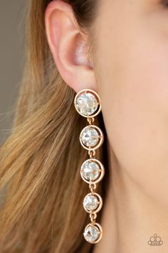 Featuring sleek gold fittings, faceted white gems gradually decrease as they trickle from the ear for a glamorous look. Earring attaches to a standard post fitting. Sold as one pair of post earrings. P5PO-GDXX-076XX Paparazzi Jewelry Images, Paparazzi Accessories Jewelry, Glamorous Look, Rose Gold Frame, Twisted Metal, Gem Earrings, Jewelry Boutique, Gold Box, The Ear