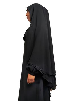 Simple and elegant is how we describe our Muhessa Niqab. Made with 2 layers of soft chiffon and draping a full 45 inches, Muhessa is designed for modesty and simplicity. Free from stones and embellishments, Muhessa is your choice for creating a look of piety and modesty. Pair Muhessa with your favorite Classic Black abaya for a classy, understated look. Made with luxuriously soft chiffon Long Niqab 45" inches Plain niqab without stones Abaya not included Made in Dubai Black Abaya, Garment Workers, Niqab, Dress Gift, Double Layer, Classic Black, Dubai, Embellishments, Tunic Tops