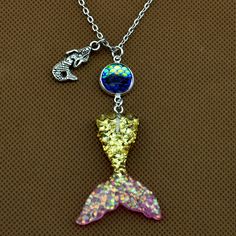 ♦ DESCRIPTION ♦ your Scale Color from a drop down menu. Mermaid Tail :33x41mm Scales: 12mm Chain measures about 22in Package: 1 Pcs The keychain packaged by OPP bag . Mermaid Tail Color: Pink blue blue &Pink Gold& Pink Purple&blue light purple Color of Scale(scales are 12mm) A:Clear B:light purple C:seaweed green D:Golden yellow E:ocean blue F:pink G:blue H:purple I:Silver gray J:Black K:blue purple L:Coffee Gold M:White All our items are NICKEL FREE and LEAD FREE. If you need more q Party Charm Pendant Necklace With Lobster Clasp, Party Pendant Charm Necklace With Lobster Clasp, Adjustable Party Charm Necklaces With Lobster Clasp, Adjustable Charm Necklaces With Lobster Clasp For Party, Themed Necklace With Lobster Clasp As Gift, Adjustable Necklace With Lobster Clasp For Birthday Gift, Themed Gold Jewelry For Party, Novelty Necklace With Lobster Clasp For Gift, Themed Silver Necklace For Birthday