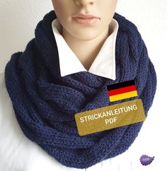 a mannequin head wearing a scarf with a german flag on it and a name tag