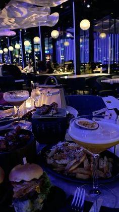 a table filled with food and drinks at a restaurant