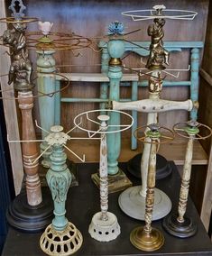 an assortment of decorative candlesticks on display