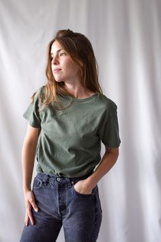 "The softest cotton crewneck tee shirt, worn here with models' own vintage jeans. I assume that this tee is made more recently* Maker: Delta Pro-Weight | Made in Honduras Material: 100% Cotton Condition: Excellent. Washed Deadstock. SMALL Shoulders: 16\" | Chest: 17.5\" | Length: 28\" | Sleeve: 6.5\" MEDIUM Shoulders: 18.5\" | Chest: 19.5\" | Length: 29\" | Sleeve: 7.5\" Hanna is 5'3\" and wears a modern small. She shows the SMALL in the first two photos and medium in remaining photos. To see mo Crew Neck Organic Cotton Washed Tops, Washed Organic Cotton Crew Neck Top, Organic Cotton Washed Crew Neck Top, Basic Washed Organic Cotton Tops, Washed Crew Neck Top For Everyday, Everyday Washed Crew Neck Top, Everyday Washed Organic Cotton T-shirt, Washed Crew Neck T-shirt For Casual Gatherings, Crew Neck Washed T-shirt For Casual Gatherings