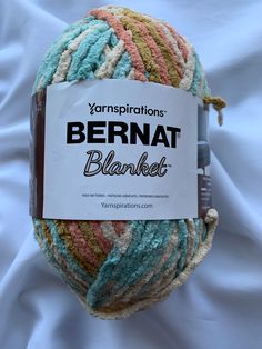 a ball of yarn with the label bernat blanketed on it's side