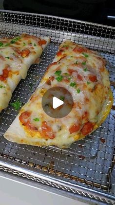 two slices of pizza sitting on top of a cooling rack