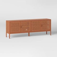 the sideboard is made out of wood and wicker