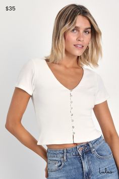 We're obsessed with how easy it is to style the Lulus My Everyday Best Ivory Ribbed Short Sleeve Button-Front Top! Stretchy ribbed knit shapes this must-have top with a V-neckline, short sleeves, and a fitted, cropped bodice. Mother-of-pearl button placket at front completes the look. Pairs perfectly with your fave high-waisted denim for a cute, warm-weather look! Fit: This garment fits true to size. Length: Size medium measures 18.25" from shoulder to hem. Bust: Great for any cup size. Waist: Fitted - stretchy fabric allows custom fit. Undergarments: May be worn with any standard bra. Fabric: Fabric is very stretchy. Front of bodice is lined. Shell: 97% Polyester, 3% Spandex. Lining: 97% Polyester, 3% Spandex. Hand Wash Cold. Do Not Bleach. Line Dry. Iron Low Heat. Imported. Lulus | My Ev Everyday Ribbed Button-up Top, Lulu Fashion, Ribbed Shorts, Button Front Top, Knit Short, Knit Shorts, Mother Of Pearl Buttons, Short Sleeve Button Up, Personal Marketing