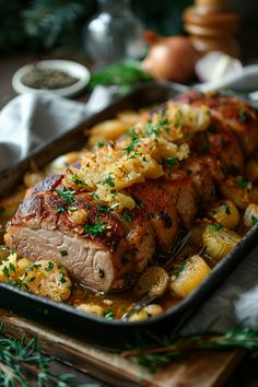 Roasted pork loin garnished with caramelized onions and fresh herbs in a baking dish. Country Ribs And Sauerkraut Oven, Pork Tenderloin With Sauerkraut, Pork Loin With Sauerkraut, Oven Roasted Pork Loin, Pork And Sauerkraut Recipe, Oven Roasted Pork Tenderloin, Pork And Sauerkraut, Oven Roasted Pork, Roasted Pork Loin